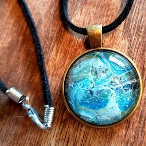 Handmade acrylic pour necklace with black cord